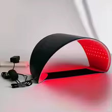 LumiThera L6 dome mask worn by woman showing full face and neck red light coverage